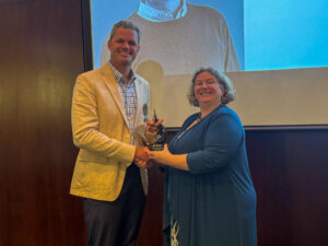 John Haven accepting award from Linda Prokopy,