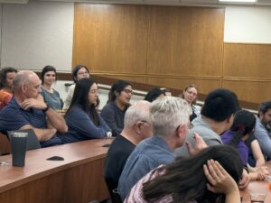 Audience giving remarks about Dr. Linda Prokopy's leadership.