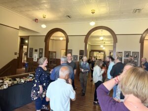 Audience mingling after remarks.