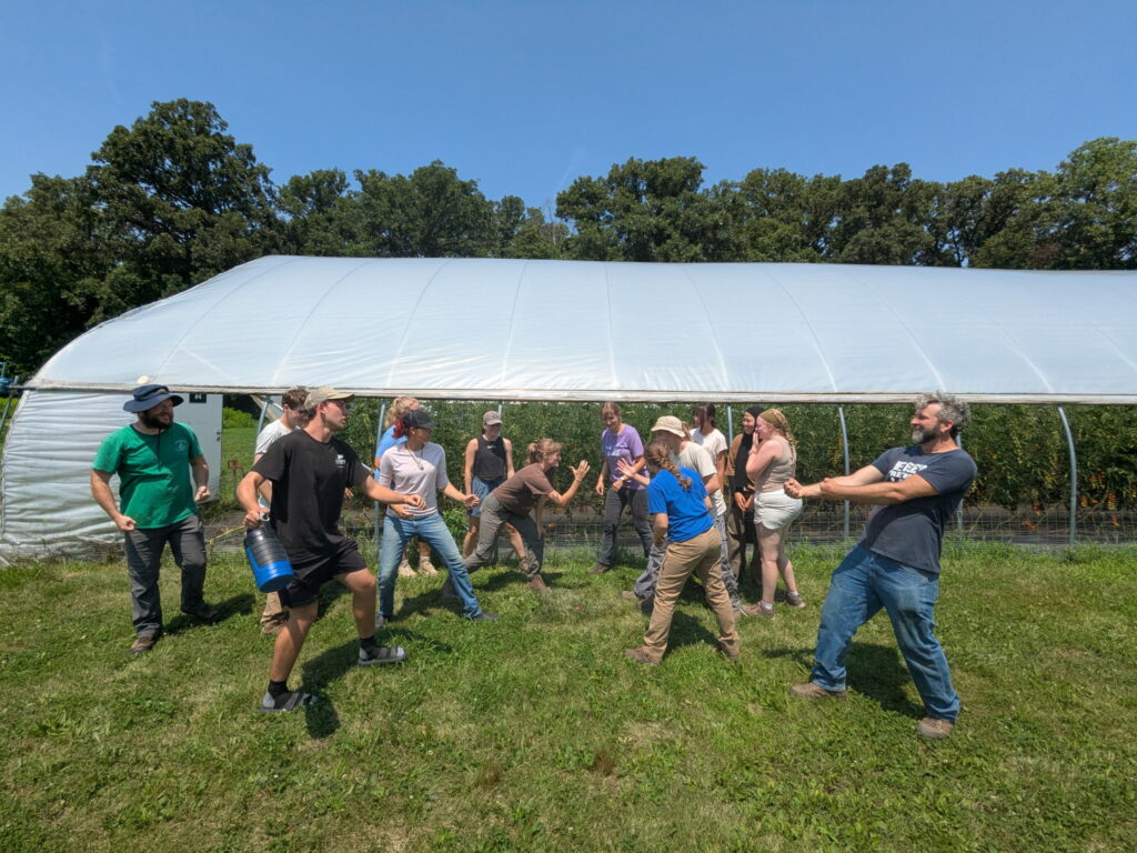 Mock battle between Purdue Student Farm interns and University of Illinois Student Farm interns.