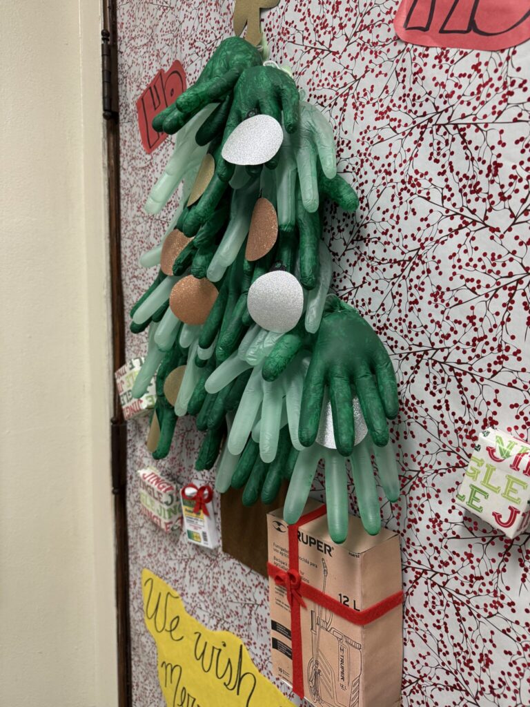 Meyers Lab door with a christmas tree made up of blown-up safety gloves.
