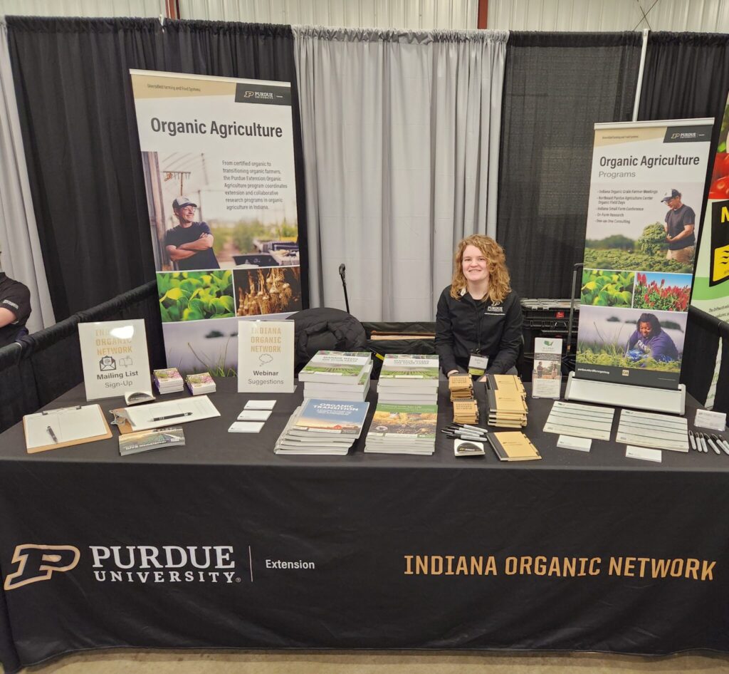 Ashley Adair, planning committee member, also staffed the Indiana Organic Network's trade show booth during the IHSFC.