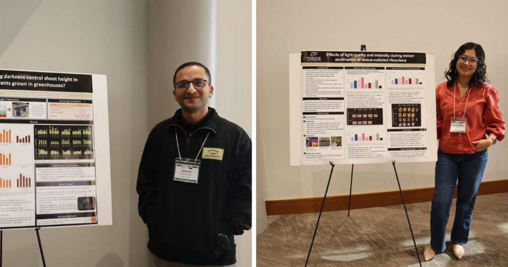 Antoine Nieuwenhuyse and Maria Fernanda Moreno standing beside their research posters.