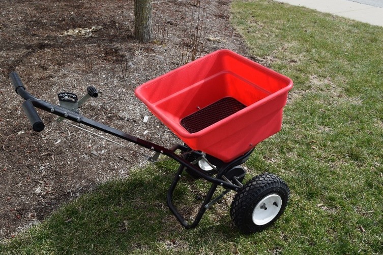Rotary and drop-type spreaders are useful for dry fertilizer distribution.