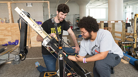 Purdue University students working on a rocket.