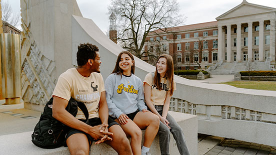 Purdue University students sitting outside.