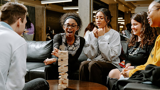 Purdue University students playing a block-building game.