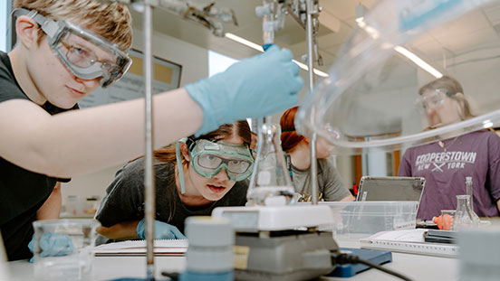 Purdue University students learning in lab.