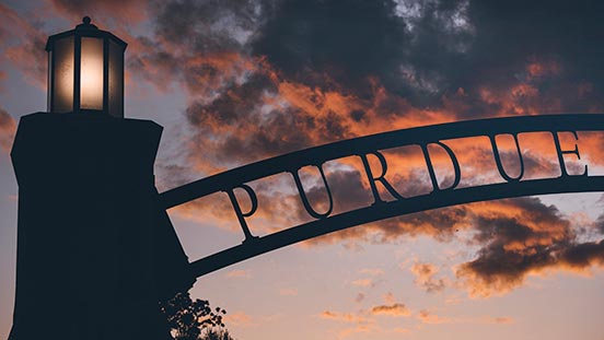 Sunset behind Purdue University arch.