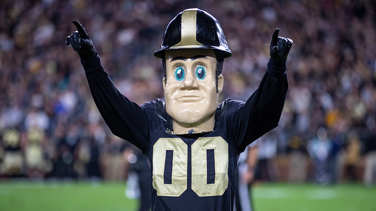 Purdue Pete cheering at a Purdue football game.