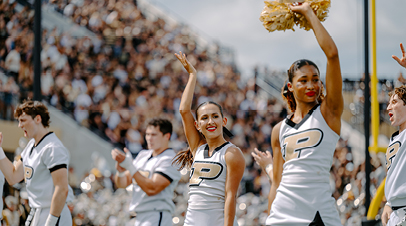 Purdue cheer members during a game. 