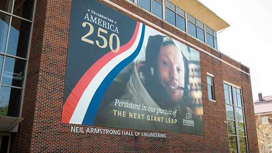 A banner celebrating America’s 250th anniversary outside of the Neil Armstrong Hall of Engineering.