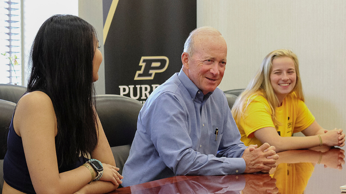 Interim President Mitch Daniels interacting with students