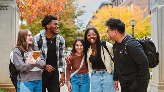 Students walking together on Purdue campus outdoors.