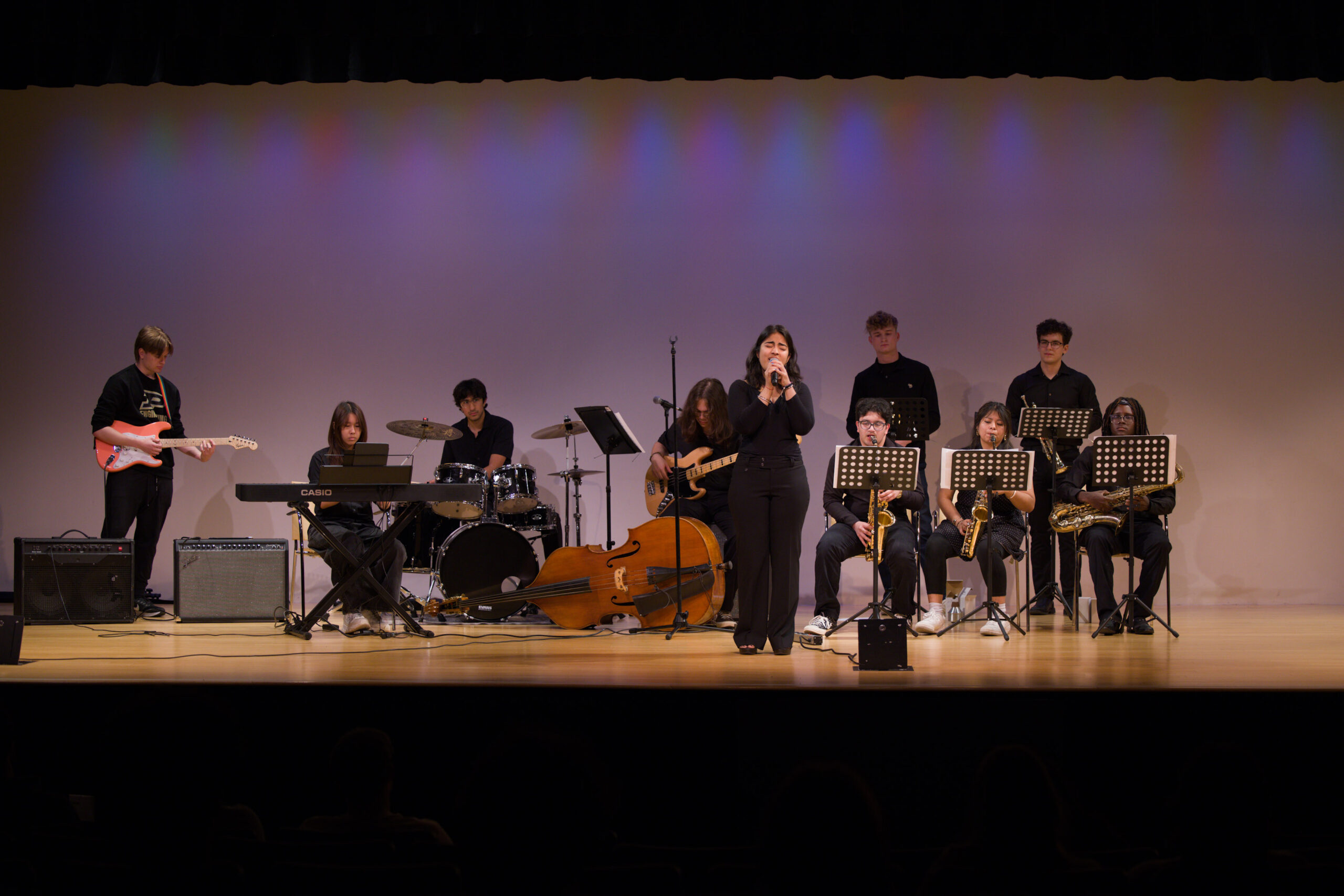 A student band playing on stage