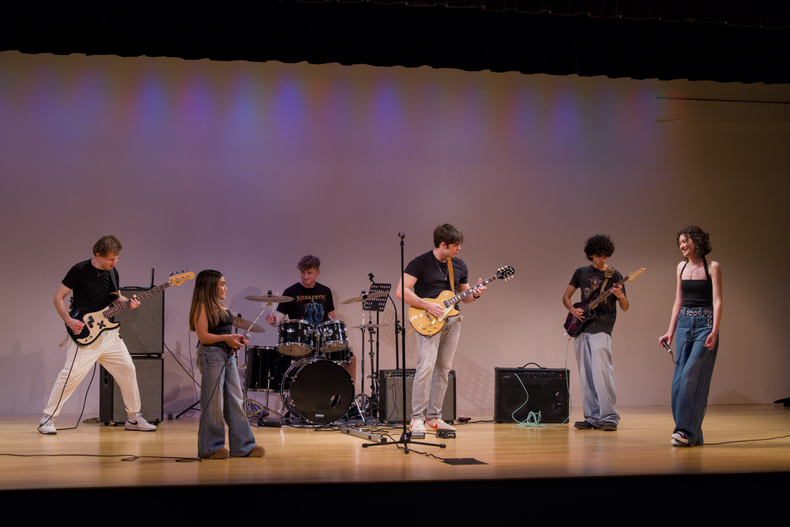 A student band playing music on stage