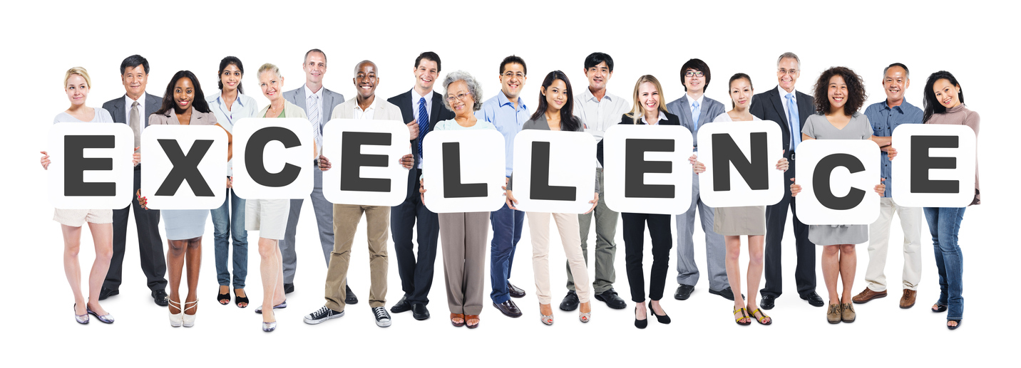 Multi-Ethnic Group Of Diverse People Holding Letters That Form Excellence