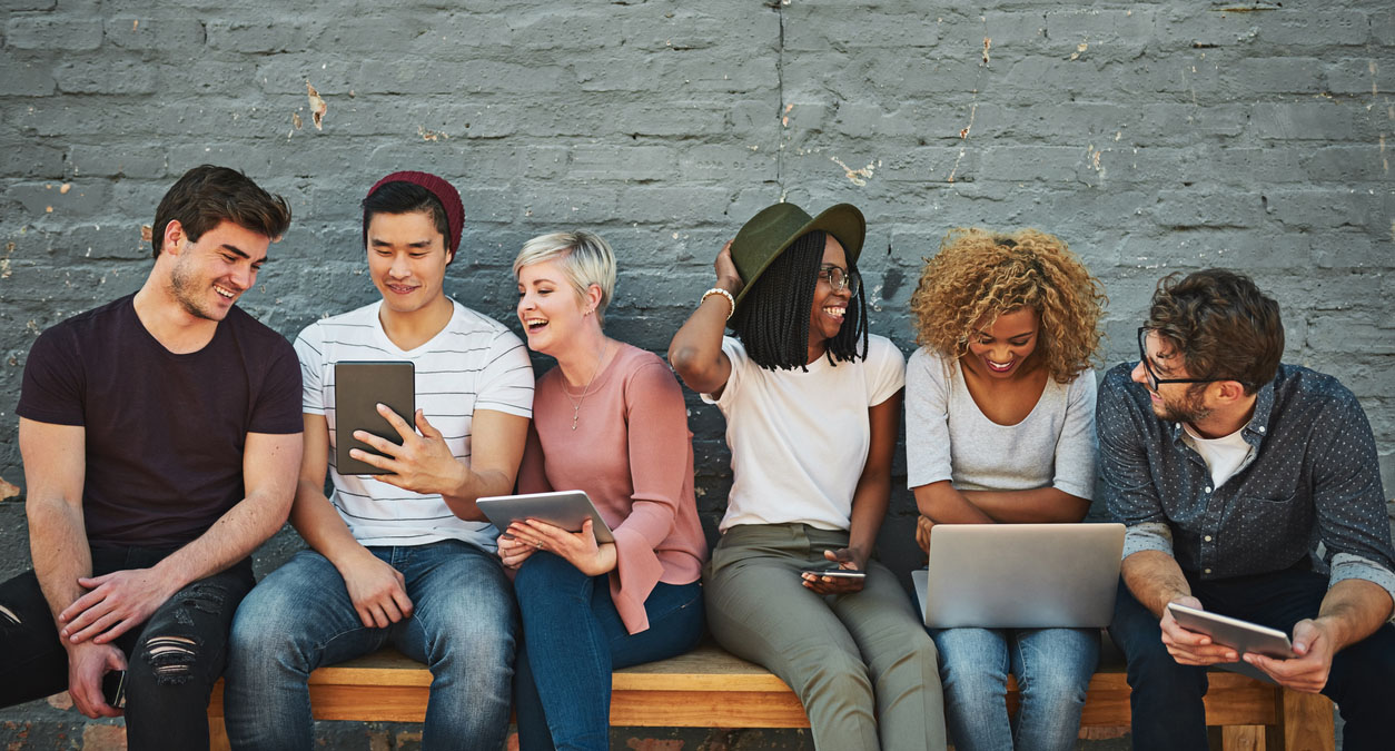 Shot of a diverse group of people social networking outside