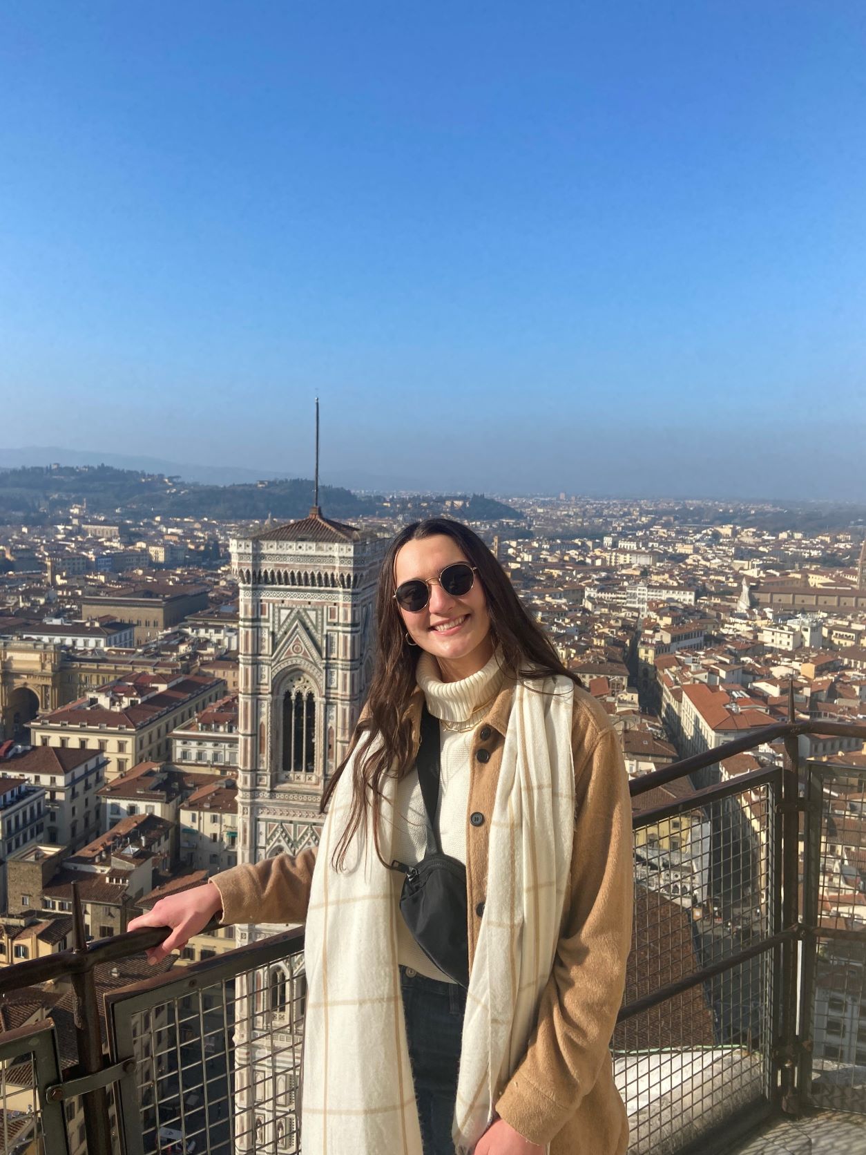 Olivia Battaglia poses with the city of Florence in the background