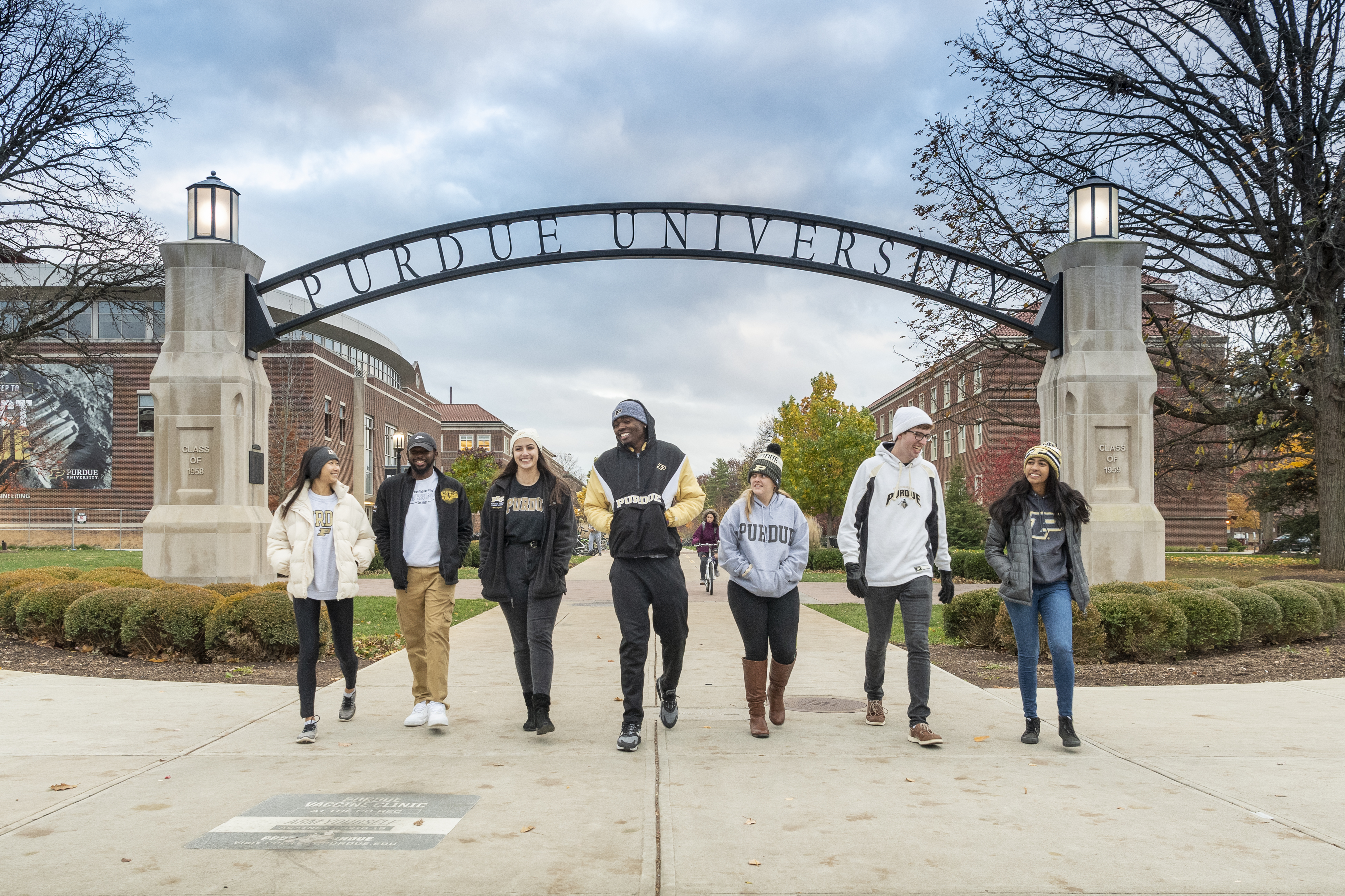 Students act out scenes by the “Gateway to the Future” arch near Armstrong Hall.