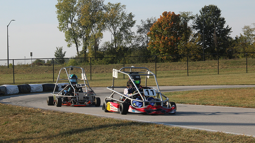 Students driving karts for the Halloween Hundred