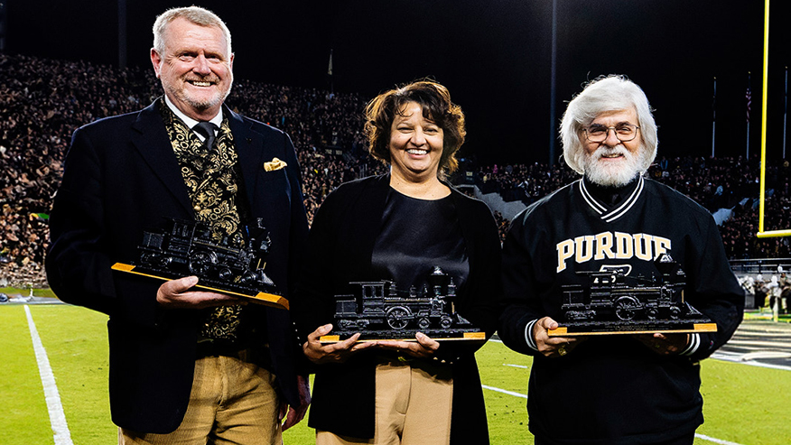 Anthony Cawdron, Renee Thomas and Frank Robert Sabol holding awards