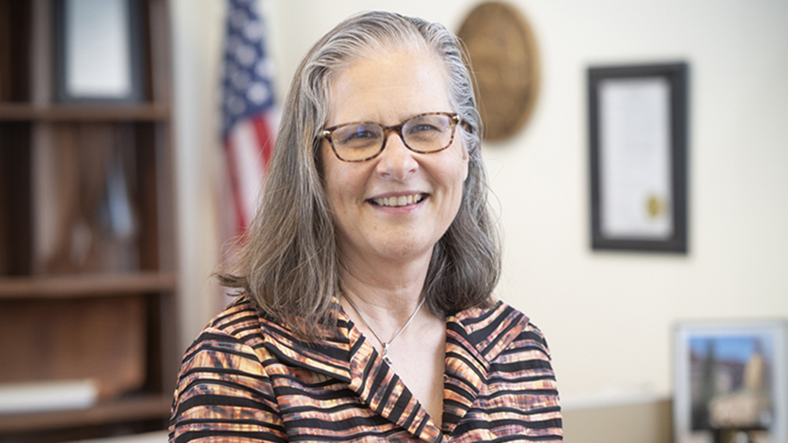Woman with glasses smiling