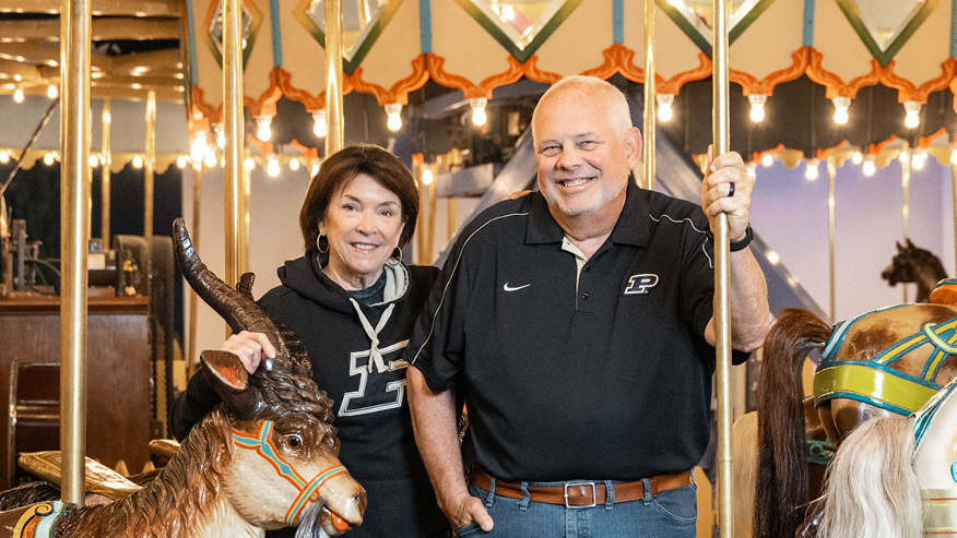 Man and woman on carousel