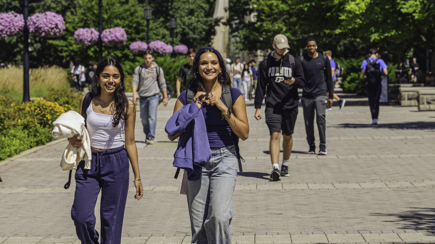 Students walking, chatting at Purdue University’s West Lafayette location.