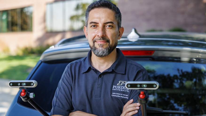 Man standing in front of car