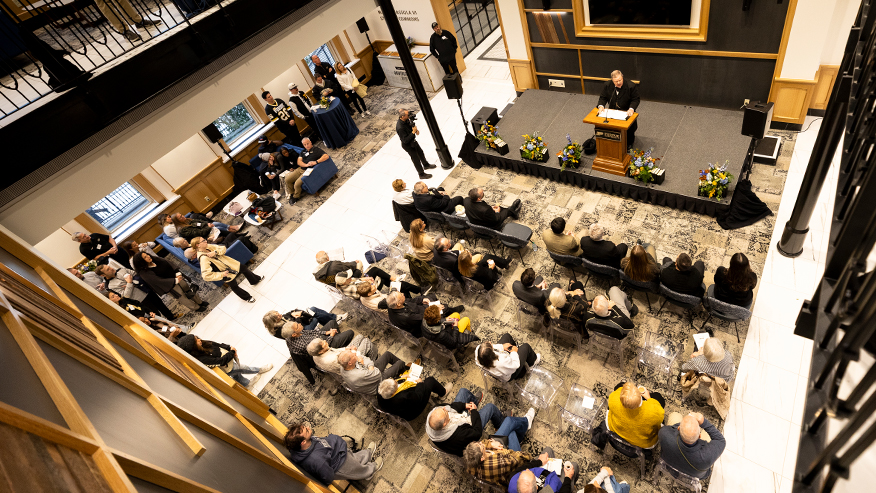 Attendees seated in University Hall listen attentively to speakers during the Oct. 25 rededication ceremony, part of Purdue’s Homecoming celebration.