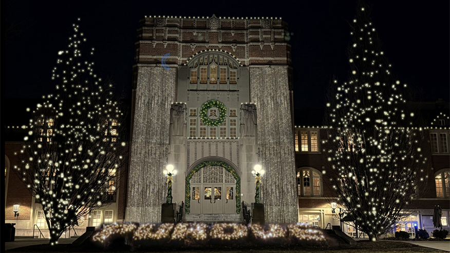 The front of Purdue Memorial Union with holiday lights spelling out PURDUE.