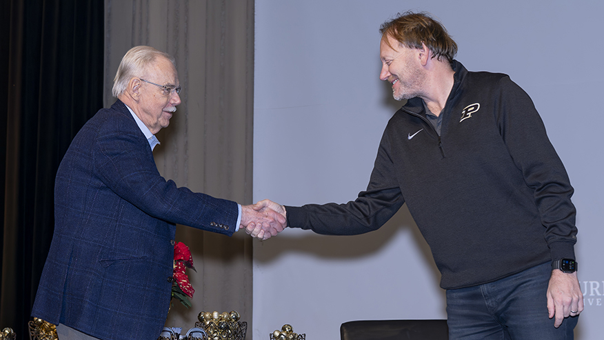Gintaras Reklaitis shakes hands with Patrick Wolfe