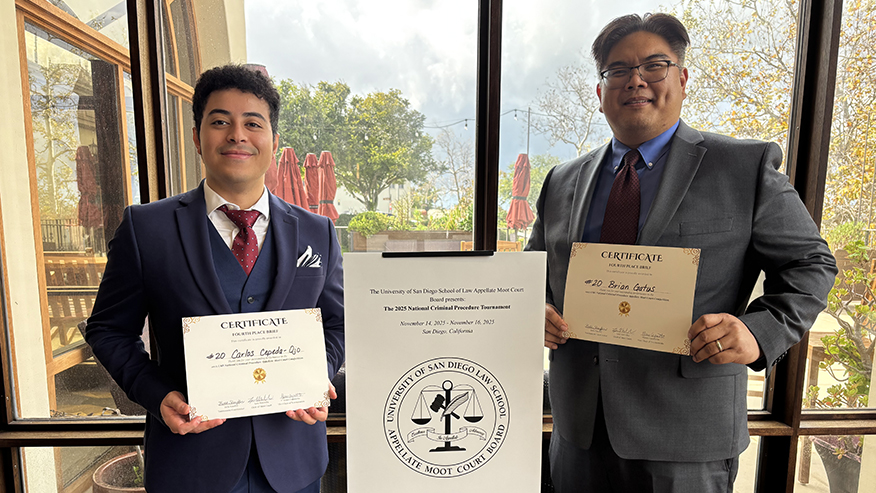 Carlos Cepeda-Ojo and Brian Gatus hold their award certificates.