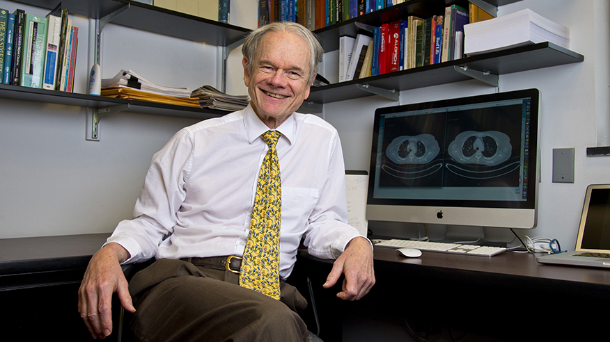 Mark Cushman sits in an office and looks into the camera.