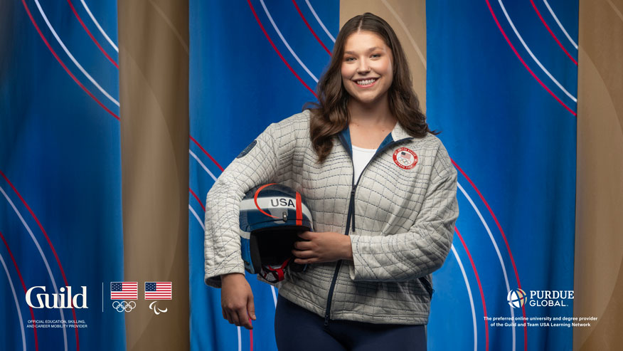 Ashley Farquharson stands holding her luge helmet