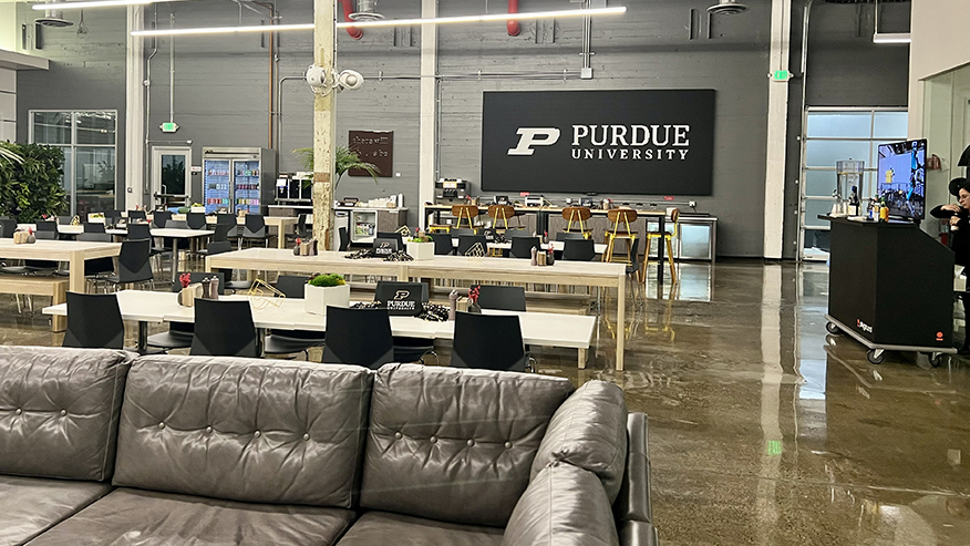 Interior photo of business open office space with couches and chairs.