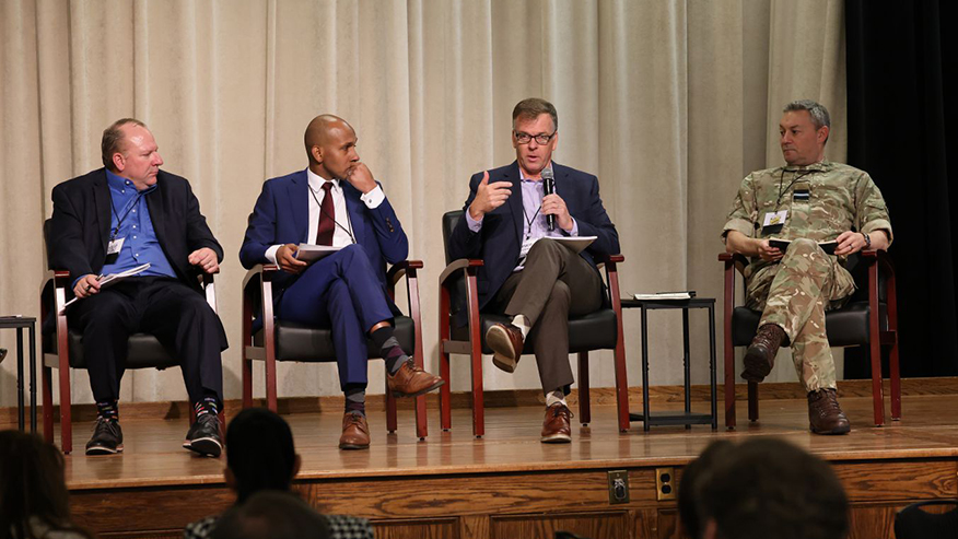Group of people seated on a stage