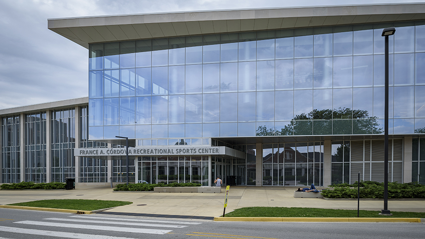 External shot of France A. Córdova Recreational Sports Center, a building with all glass windows.