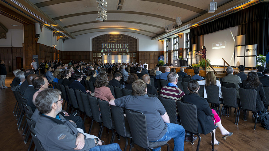 Attendees sit facing the stage in a Purdue Memorial Union ballroom.