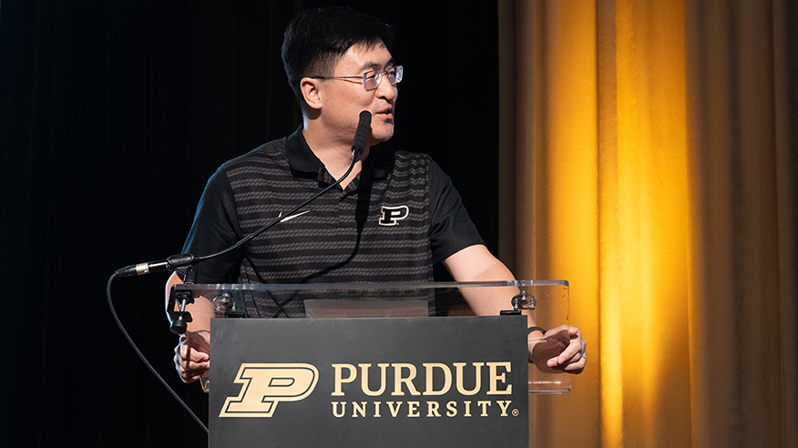 Mung Chiang speaks at podium.