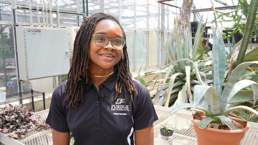Woman in greenhouse