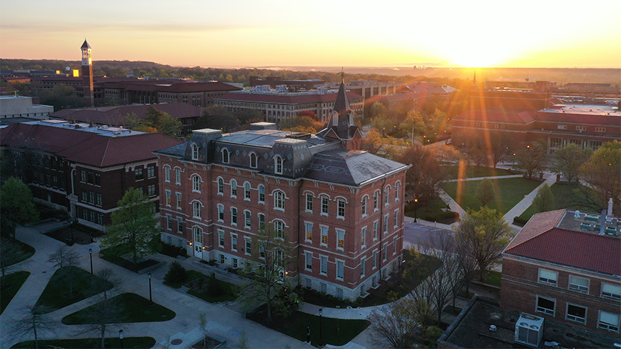 Birds-eye view of campus buildings at sunrise.