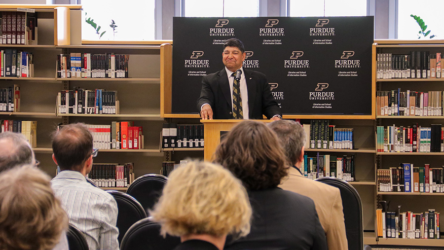 Sunil Prabhakar, executive vice provost, stands at a podium and addresses a crowd at the “A Celebration of Books Fall 2026” event.
