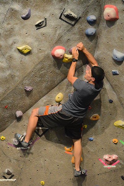 A man on a rock climbing wall