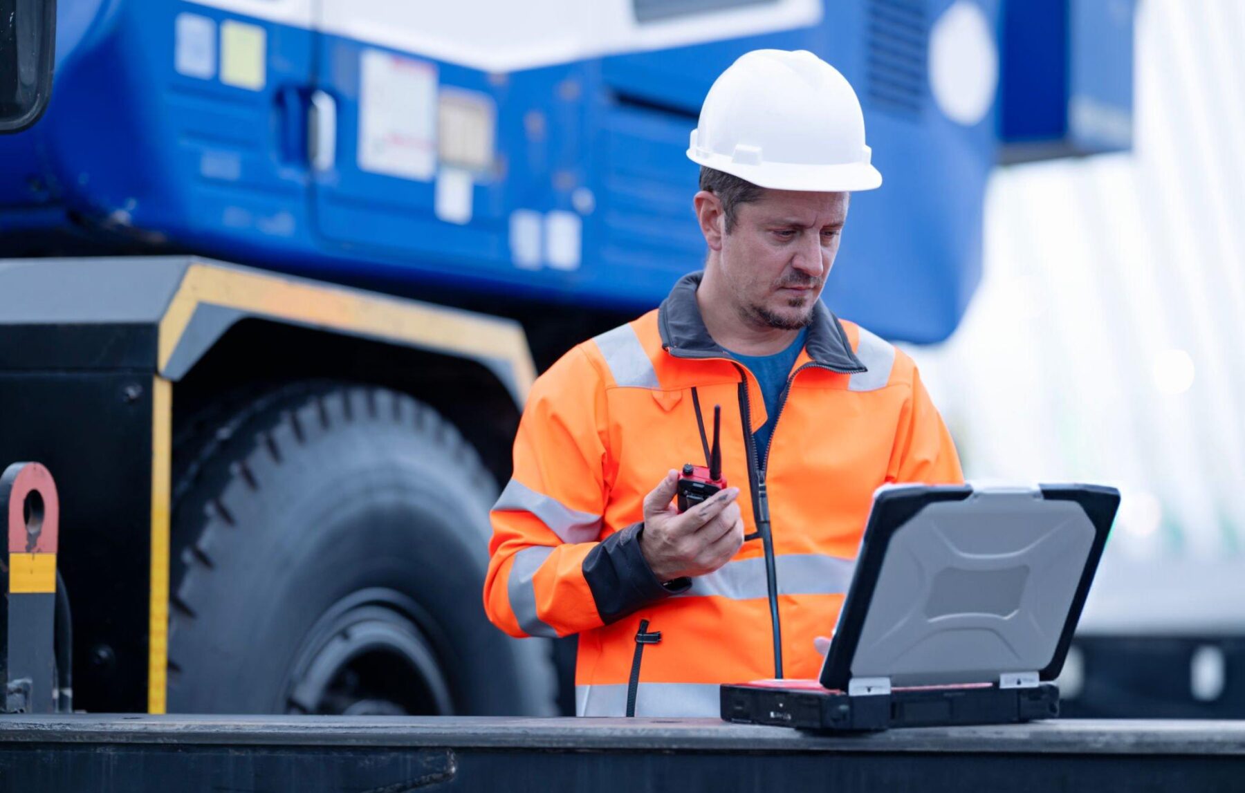 construction worker using laptop