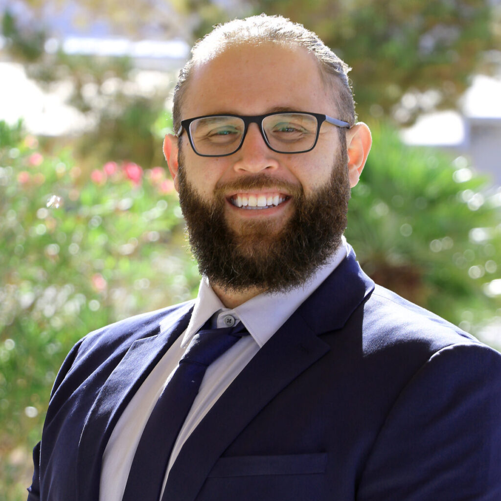 Frank Pulciano, a Purdue online Doctor of Technology student, poses for a headshot. He is wearing a navy suit and smiling.
