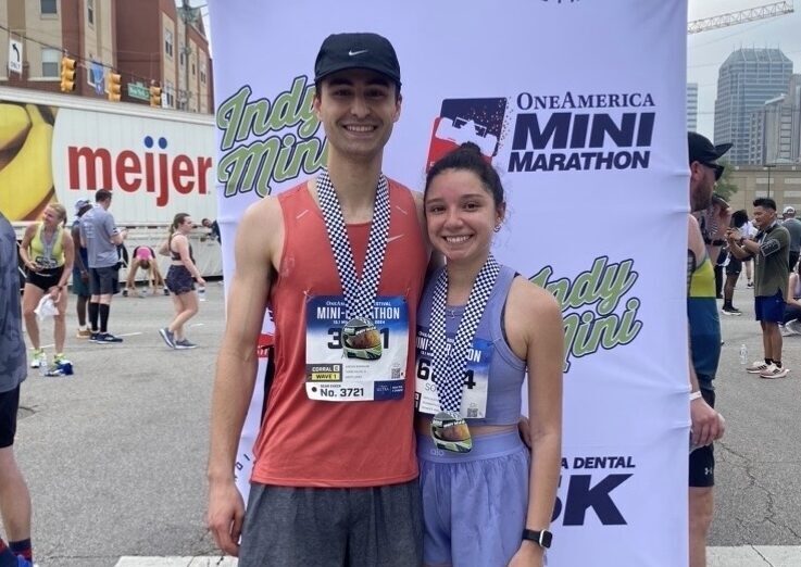 Ayrton and his fiancee, Sophia, pose at a photo booth for the One America Mini Marathon