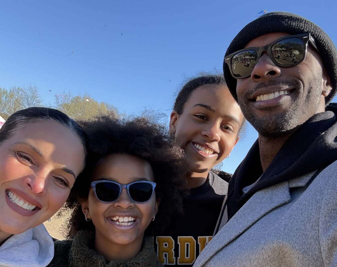 Tamara Grant poses with her family on a sunny day