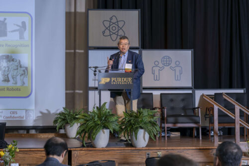 Tetsuo Endoh, professor and director of the Center for Innovative Integrated Electronic Systems (CIES) at Tohoku University. Tetsuo Endoh addressing a crowd at Purdue University. He is wearing a navy blue blazer and light blue dress shirt.